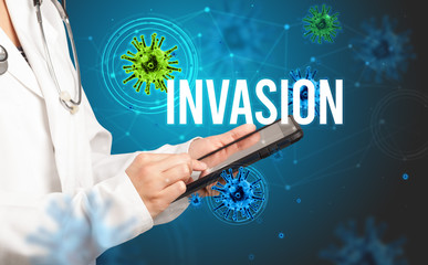 doctor prescribes a prescription with INVASION inscription, pandemic concept