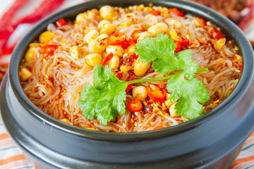 Chinese food hot and sour spicy glass noodle soup close up
