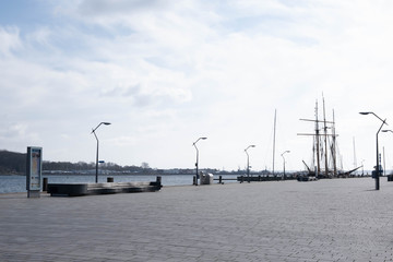 deserted harbor and coast of the Baltic Sea in a European city during covid-19,
