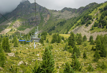 Fototapeta na wymiar Pejo 3000 chairlift : the chairlift that reaches an altitude of 3000 meters,Pejo, Trentino Alto Adige, Italy - august 10, 2019.