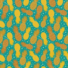 Pineapples on blue background seamless pattern