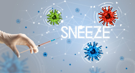 Obraz na płótnie Canvas Syringe, medical injection in hand with SNEEZE inscription, coronavirus vaccine concept