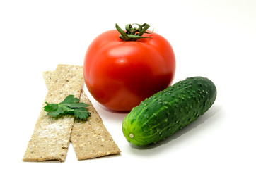 Cucumber and tomato with bread on a white background