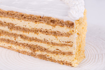 Cut cakes with different fillings, cows and cream, berries and chocolate
