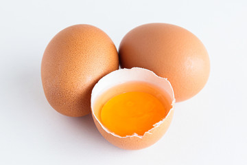 Organic eggs have been peeled off, seeing fresh yolks. The concept of food that is beneficial to the body, cheap, provides high energy. white background