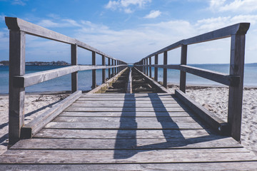 Naklejka premium old broken wooden pier on the European sea