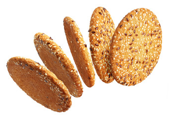 Flying tasty oatmeal cookies, isolated on white background