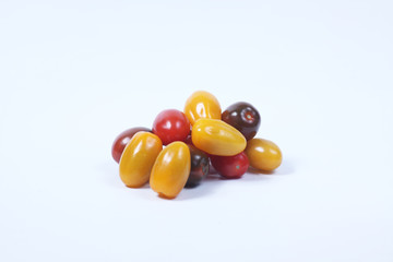 a pile of cherry-tomatoes isolated on white background. Horizontal image