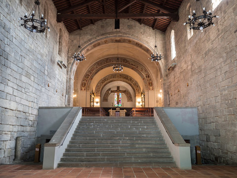 Interior of the medieval abbey of Abbadia San Salvatore, Italy. Stairway leading to the altar and side entrances to the underground crypt.