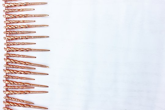 Shiny golden tinsel for Christmas tree decoration isolated on white. Christmas background for textan white background. Multi-colored rain. - Powered by Adobe