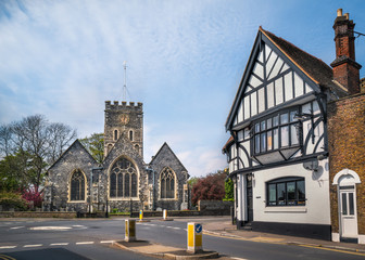 The church and impressive black at white building on the central roundabout in the village of St...
