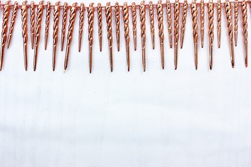 Shiny golden tinsel for Christmas tree decoration isolated on white. Christmas background for textan white background. Multi-colored rain.