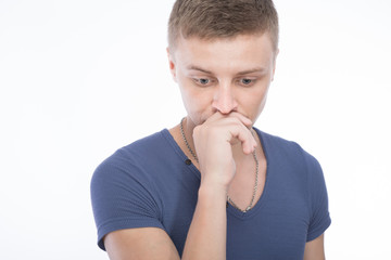 Portrait of handsome young thoughtful man