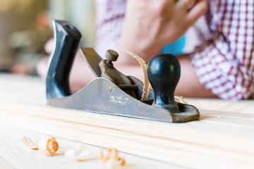 Hands working planer