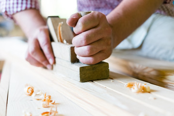 Hands working planer