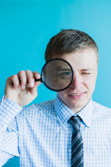Fototapeta na wymiar businessman with a magnifying glass
