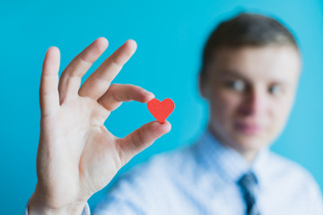 Small paper heart in arm