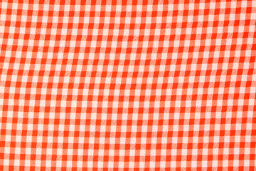 Chequered red-white background. Chequered red-white Synthetic fabric texture, background. Red fabric