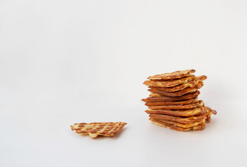 Waffle cookies and seeds isolated on a white background.