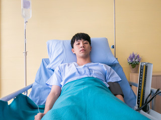 Asian patient young man has a fever and coronavirus or Covid-19 disease after check diagnosis...