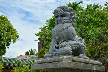 Fototapeta premium Stone sculpture of a Chinese dragon in the Assembly Hall of Fujian Chinese. Hoi An, Vietnam