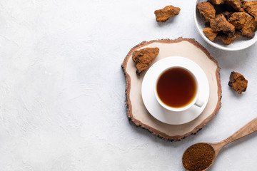 Organic Chaga mushroom coffee on light background. Top view. Horizontal. Copy space.
