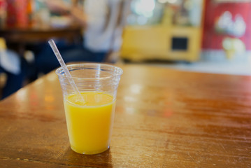 Indoor medium shot of a Cup of Orange Juice