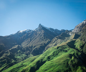 Fototapeta premium View on usually shaped mountain during sunny day, made on Rob Roy Glacier Track in New Zealand