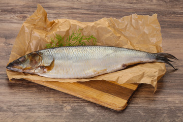 Salted herring over the wooden board