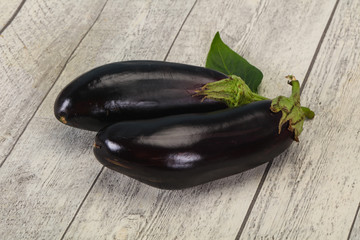 Ripe tasty Eggplant over wooden background