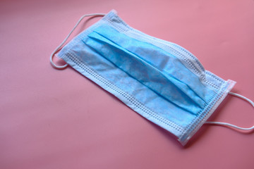 Medical mask i on pink background, Corona protection