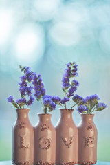 Purple flowers in a vase - 340029046