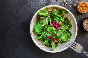 Healthy salad, leaves mix salad (mix micro greens, juicy snack) keto or paleo menu recipe. food background, copy space for text