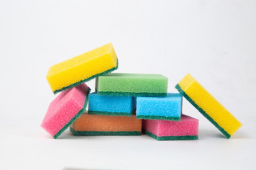 Colored sponges for washing dishes. Cleaning of the kitchen.