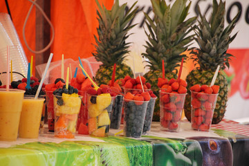 Plastic glasses with fruits of the forest