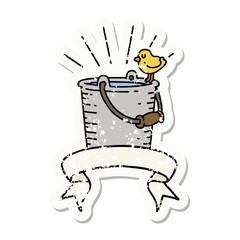 grunge sticker of tattoo style bird perched on bucket of water