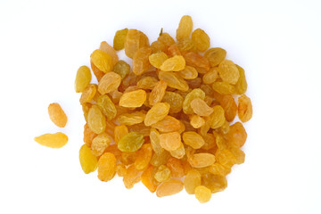 Yellow raisins of medium size from one grape of white grapes. Raisins on a white background top...
