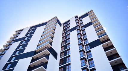 Modern apartment buildings on a sunny day with a blue sky. Facade of a modern apartment building