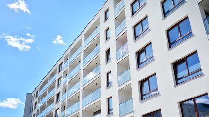 Modern apartment buildings on a sunny day with a blue sky. Facade of a modern apartment building