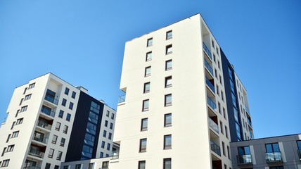 Modern apartment buildings on a sunny day with a blue sky. Facade of a modern apartment building