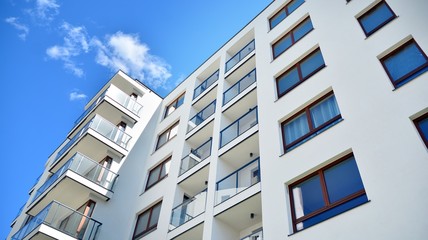 Modern apartment buildings on a sunny day with a blue sky. Facade of a modern apartment building