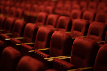 Fototapeta red velvet seats for spectators in the theater or cinema obraz