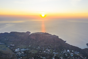 Beautiful panoramic aerial view photo from flying drone on Vulcano Island to Lipari and Salina...