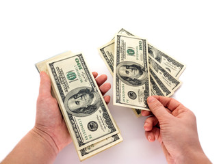 American dollars and hand isolated on a white background. To count money. Banknotes and hands. Business and finance.