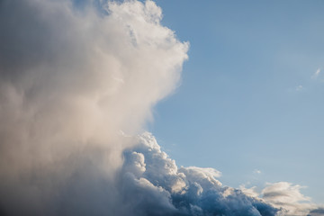 Bright blue cumulus clouds with silver lining background