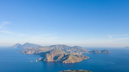 Beautiful panoramic aerial view photo from flying drone on Vulcano Island to Lipari and Salina...