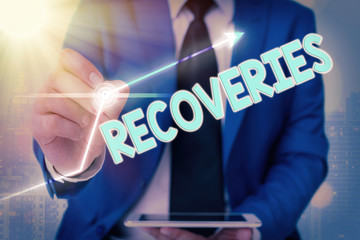 Text sign showing Recoveries. Business photo text process of regaining possession or control of...
