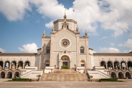 Milan, Italy - June 8, 2019: Monumental cemetery (Italian: Cimitero Monumentale di Milano). One of the richest tombstones and monuments in Europe