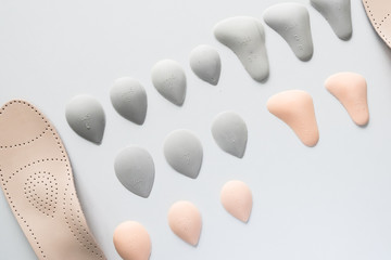 Orthopedic insoles on a white background. Treatment and prevention of flat feet and foot diseases....