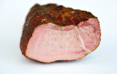 
appetizing piece of smoked meat on a white background